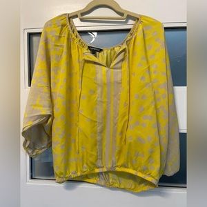 Lightweight, flowy yellow business casual top. Perfect for a day at the office.